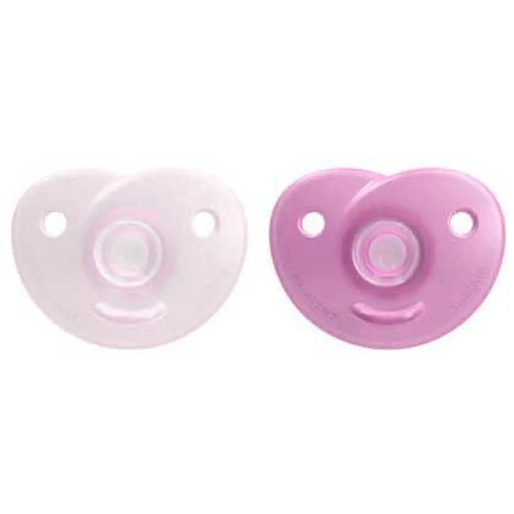Two light pink and raspberry pink Philips AVENT soothers designed for babies 0-6 months, featuring a unique silicone design to develop natural absorbency, used by medical professionals and ideal for premature babies.