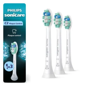 Three white Philips Sonicare C2 Optimal Plaque Control toothbrush replacement heads for a rechargeable electric toothbrush, removing up to 7x more plaque.