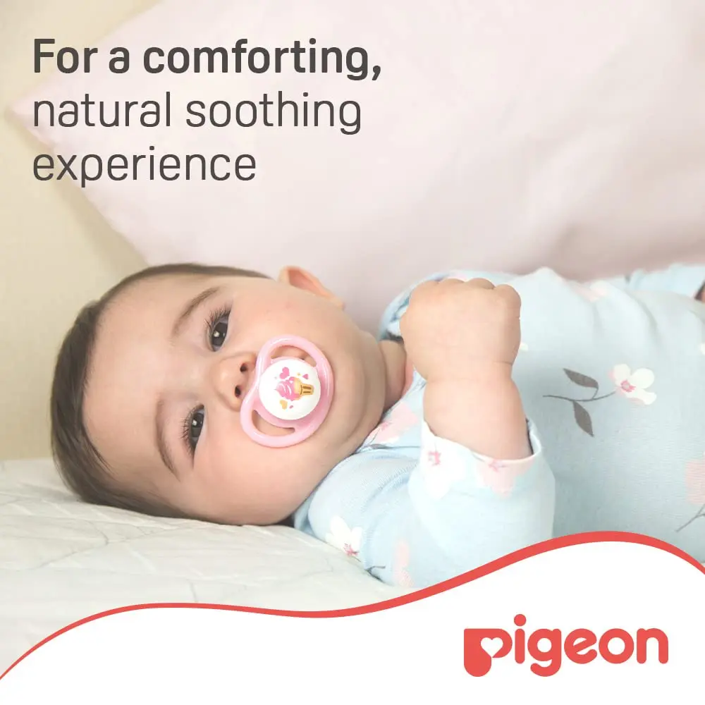 A pink Pigeon Minilight pacifier with a soft silicone nipple designed for baby girls, featuring an ultra-light design to prevent skin irritation and promote nasal breathing.