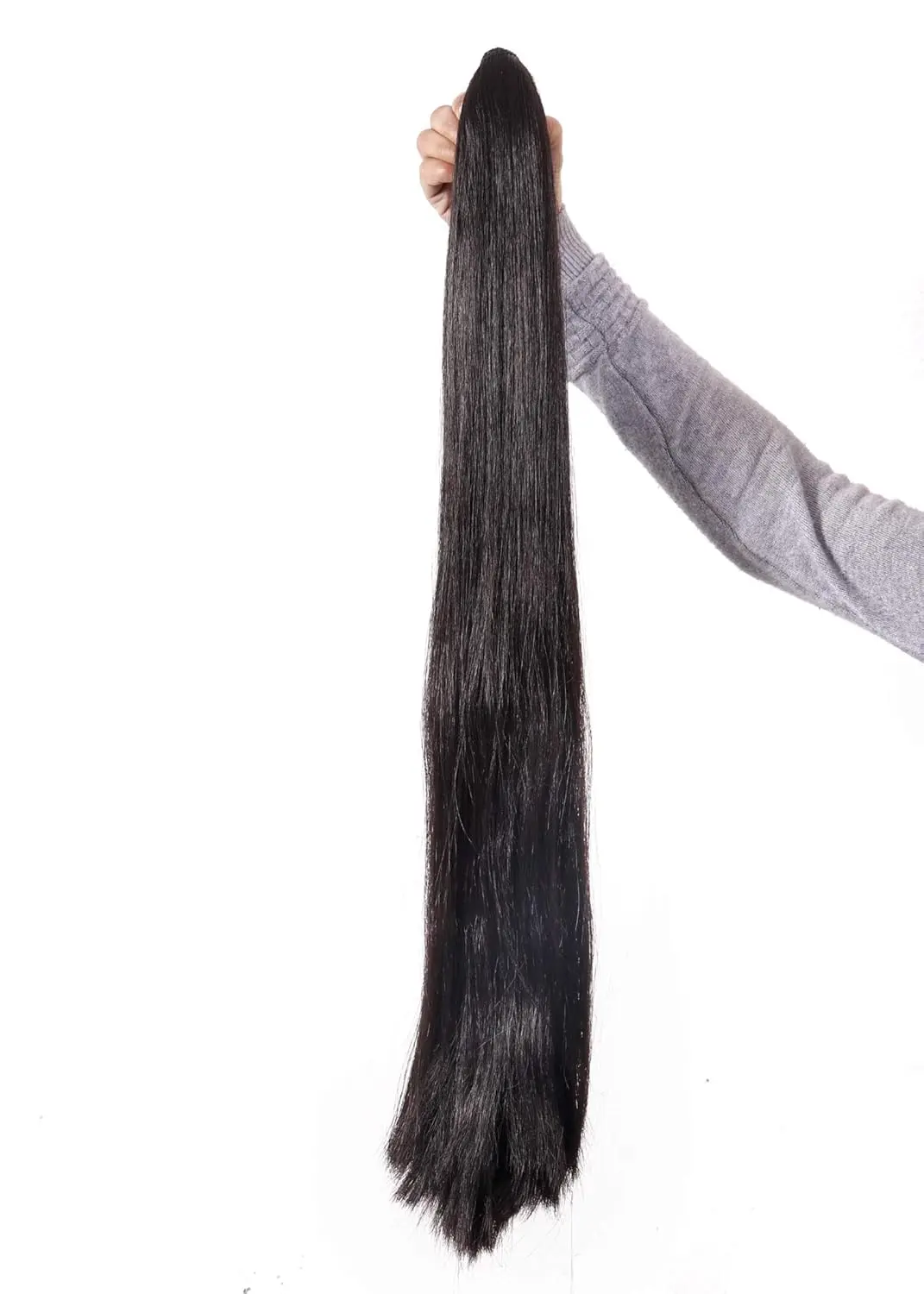 This long, black ponytail extension wig for women and girls is made of synthetic hair and looks and feels like real hair.