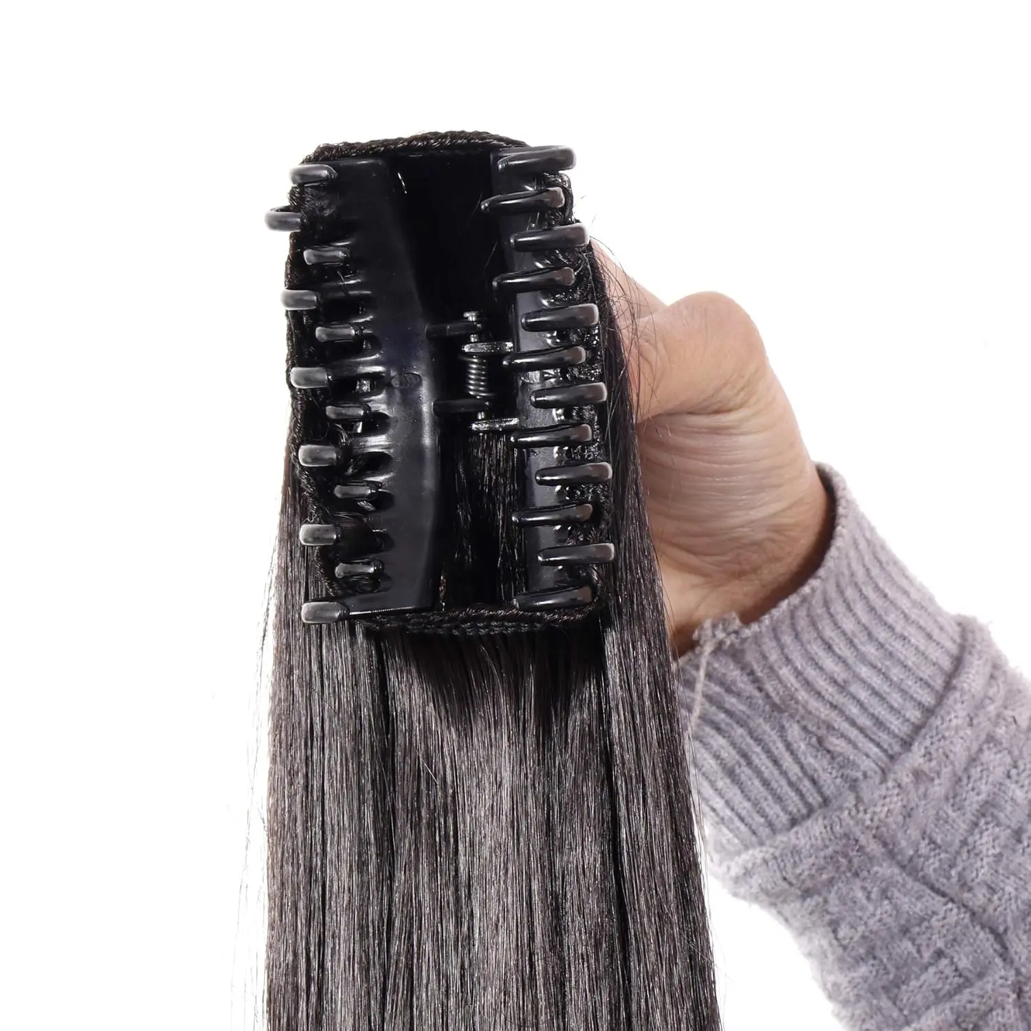 This long, black ponytail extension wig for women and girls is made of synthetic hair and looks and feels like real hair.