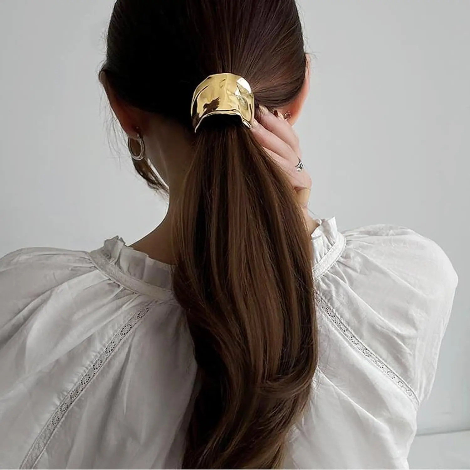 Two French-style metal ponytail holder hair clips in gold and silver, perfect for creating elegant and simple hairstyles for women and girls.