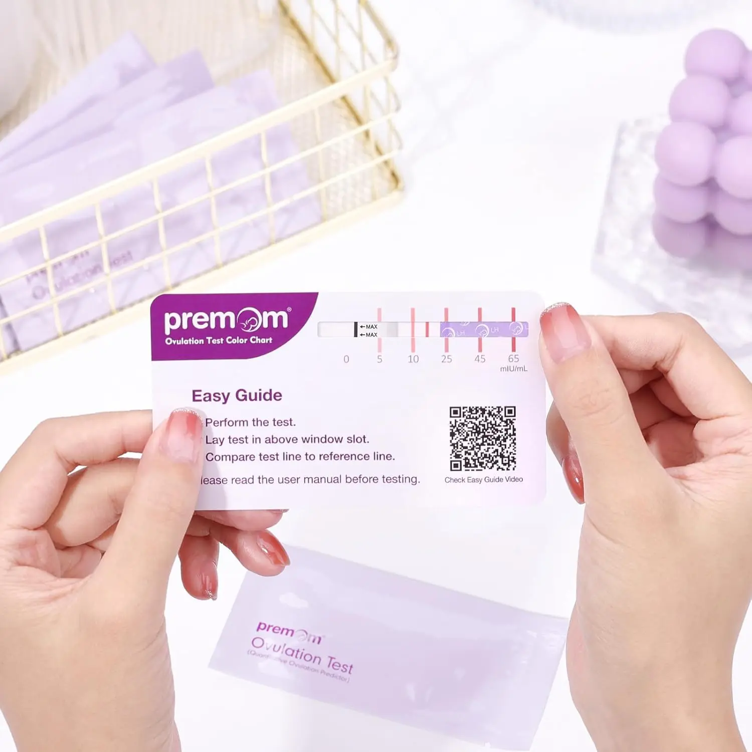Premom ovulation test strips kit with digital reader app helps women trying to conceive predict their fertile window with quantitative LH level tracking.