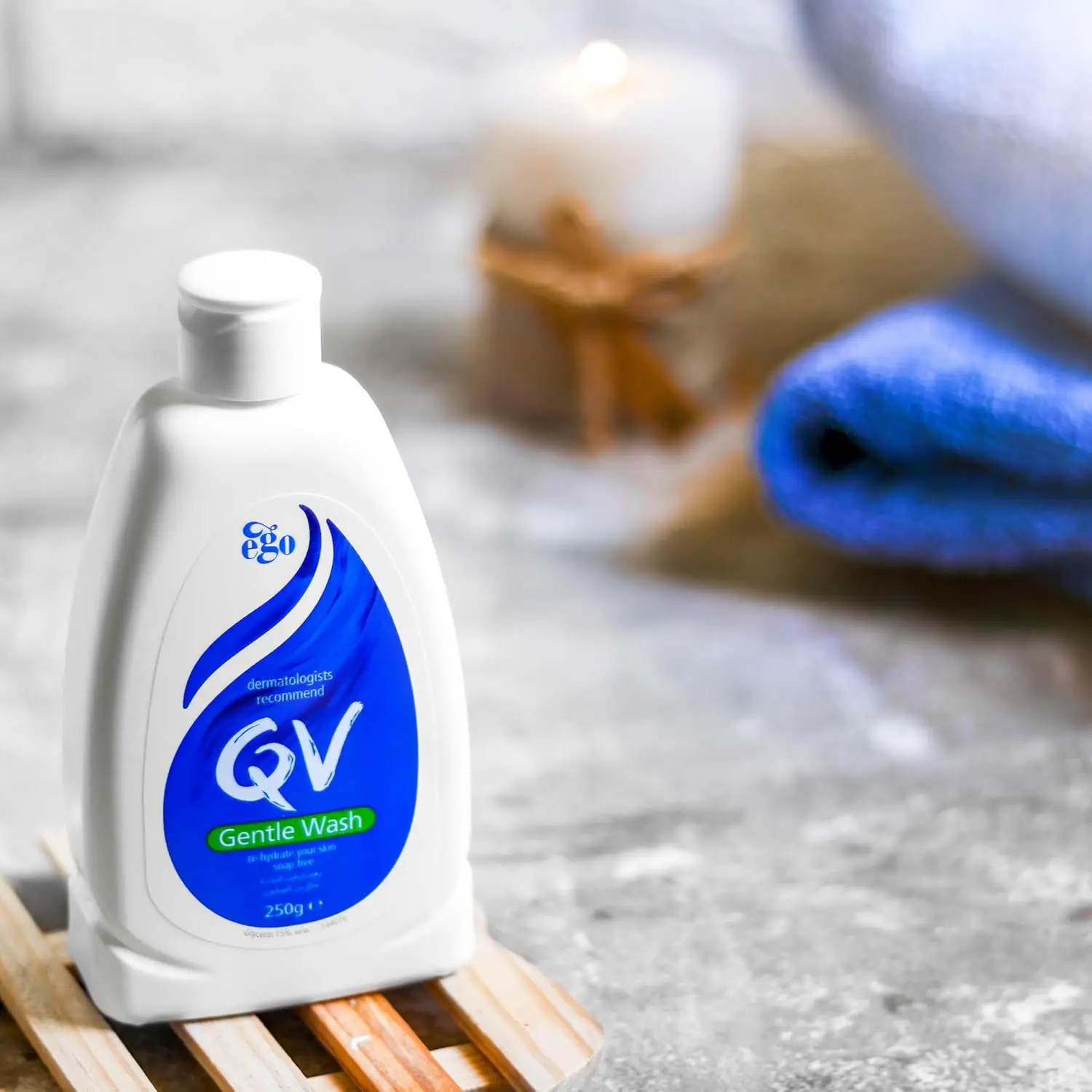 A bottle of QV Gentle Wash, a soap-free and fragrance-free body wash formulated for hydrating and cleansing dry, sensitive skin without stripping its natural oils.