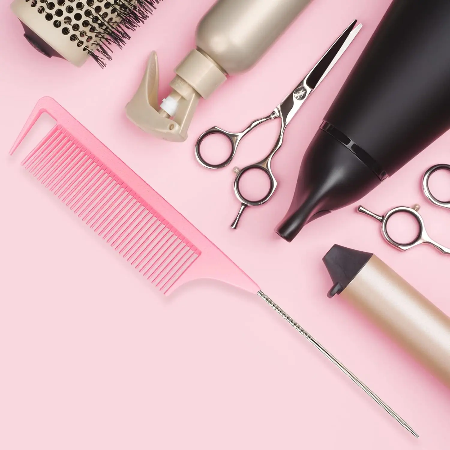 A pink rat tail comb with a stainless steel pintail is displayed, highlighting its fine teeth and design ideal for sectioning, parting, and styling hair.