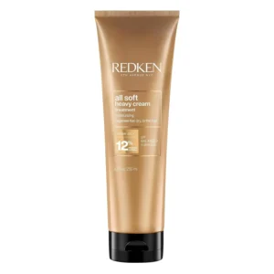 Redken All Soft Heavy Cream Mask, infused with argan oil, deeply hydrates dry, brittle hair for a soft, touchable feel.