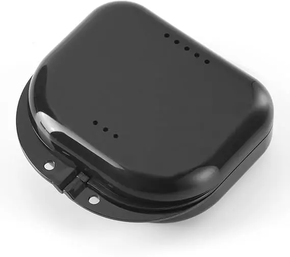 Black retainer box made of sturdy plastic, ideal for storing and protecting mouth guards, dentures, and orthodontic retainers, keeping them safe, clean, and free from damage and bacteria.