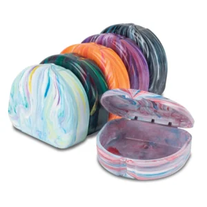 This pack of three USA-made, BPA-free plastic retainer cases in assorted colors features a vented hinge and includes identification stickers, with an interior depth of 7/8 inch, ideal for storing orthodontic aligners or mouth guards.