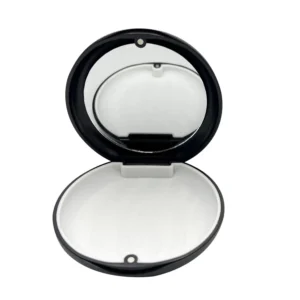 Black orthodontic retainer case with inlaid mirror and magnetic closure for easy aligner removal.