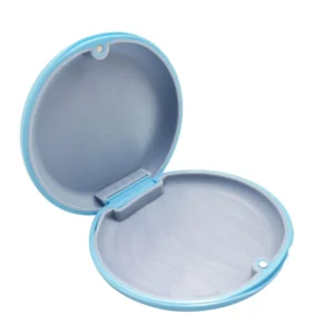 Blue orthodontic retainer case securely holds aligners, mouth guards, and dentures with a magnetic closure and silicone liner.