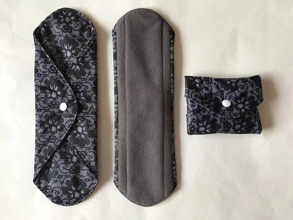 Six 12-inch MUMBABY reusable charcoal bamboo cloth menstrual pads for heavy flow, a sustainable and comfortable alternative to disposable sanitary napkins.