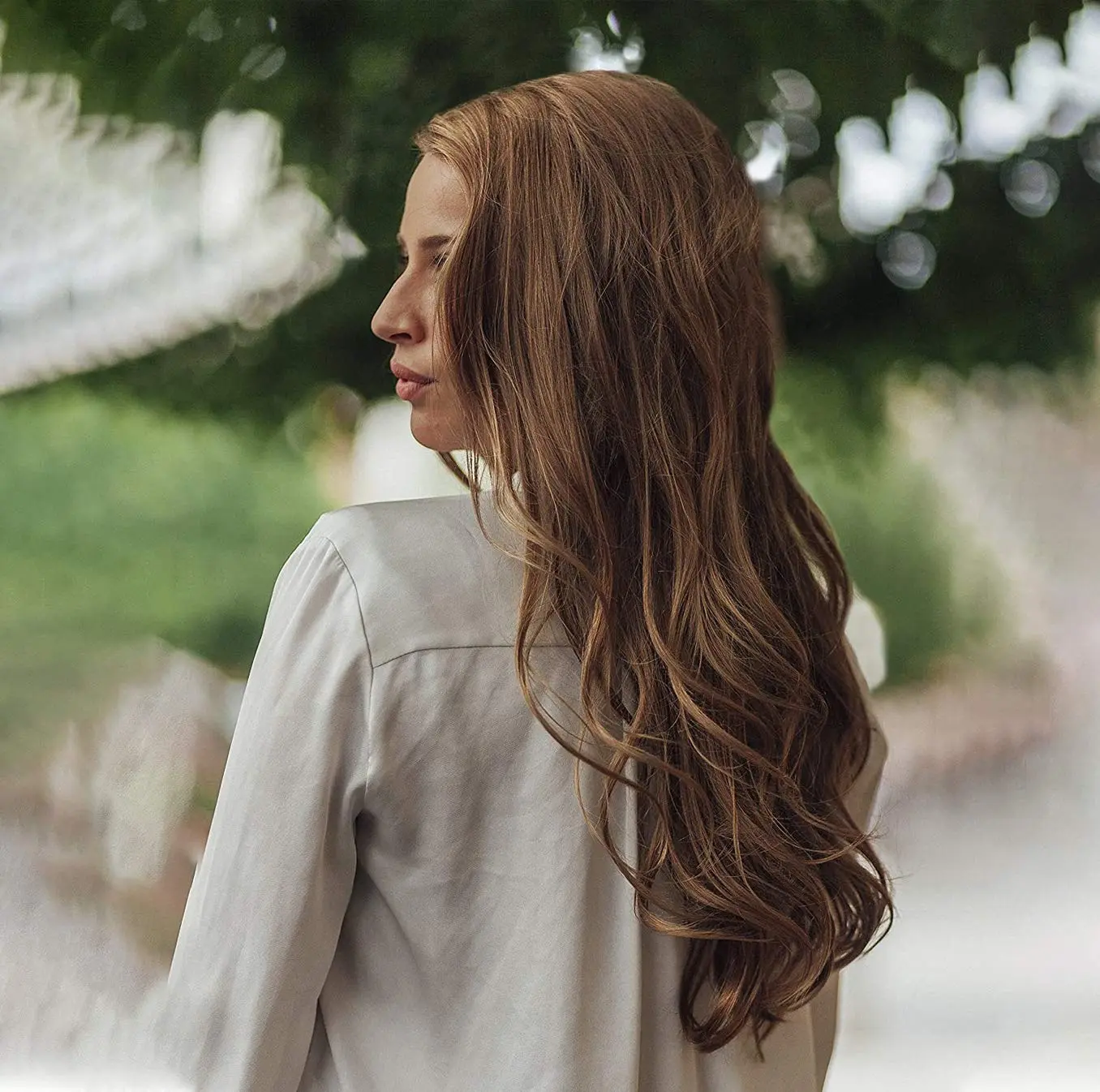 The Revlon Fast and Light Hair Dryer in black boasts 2000 watts for quick drying, ionic ceramic grille for frizz control, and includes a smoothing concentrator.