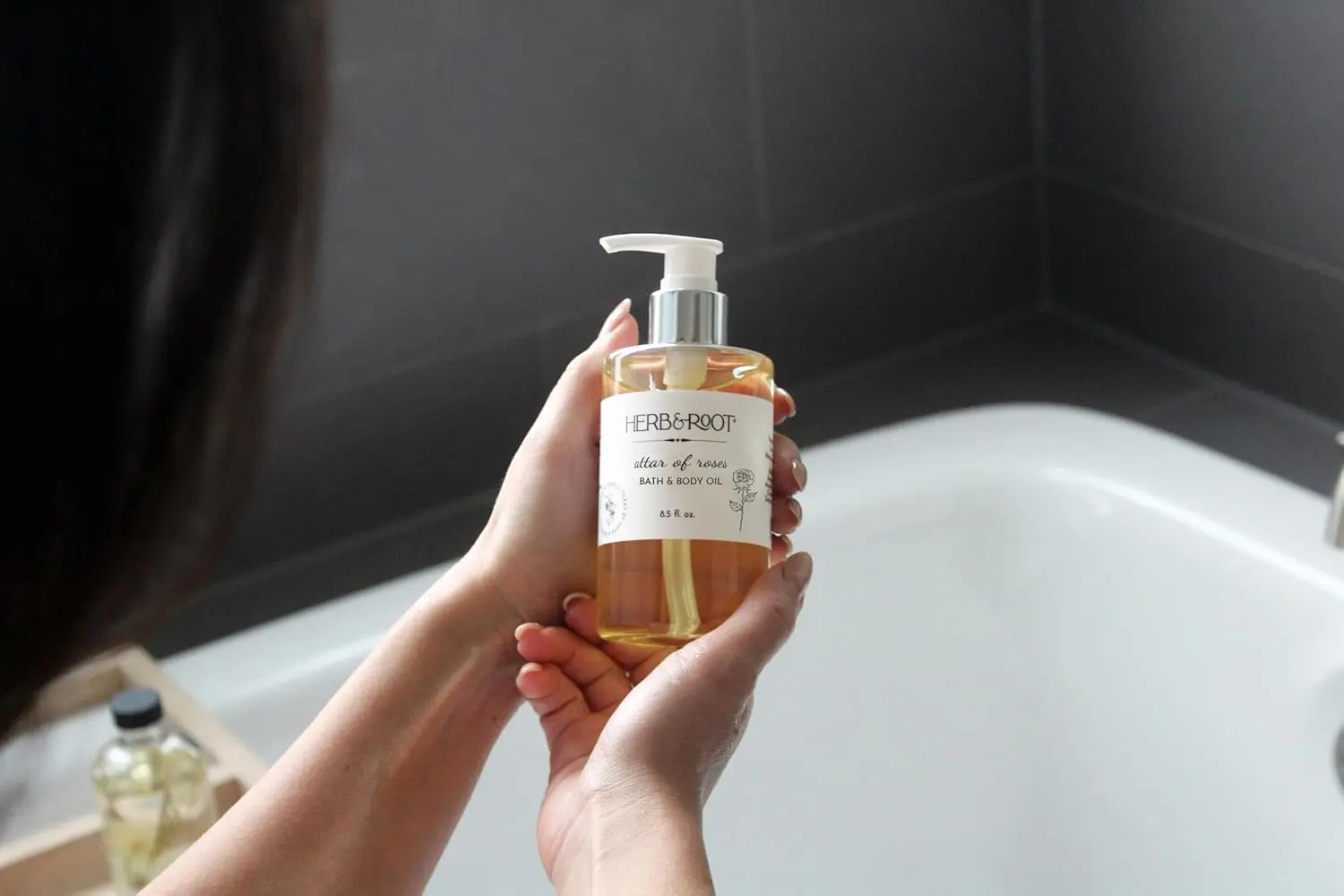 Herb & Root rose and sandalwood bath oil is a multi-use moisturizer crafted with almond, rice bran, and grapeseed oil.