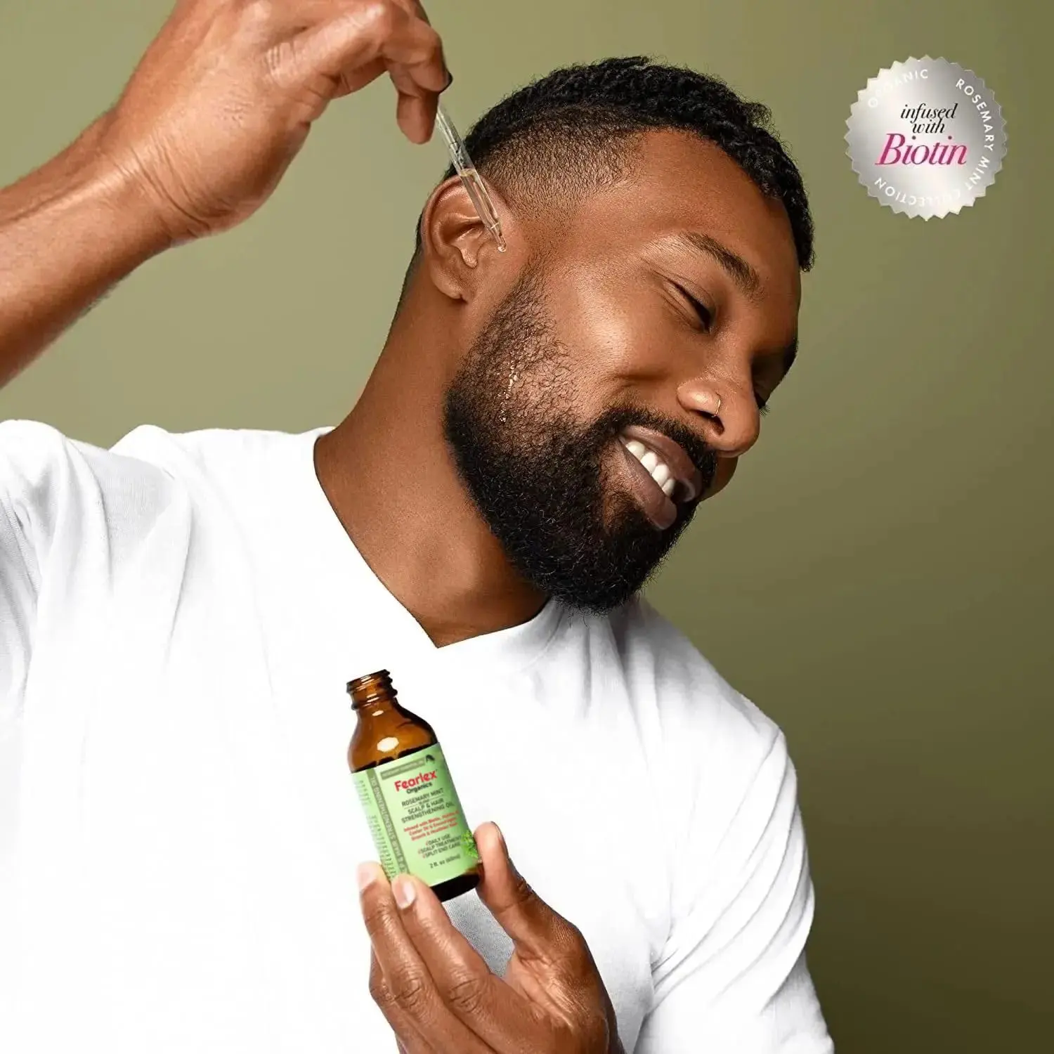 Fearlex rosemary mint hair oil infused with biotin promotes healthy hair growth, strengthens hair, and nourishes the scalp with natural organic ingredients.