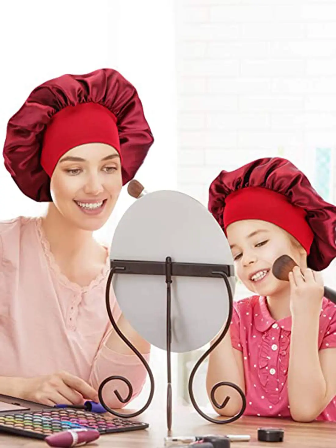 This set features two soft satin bonnets with elastic bands, designed to protect hairstyles and reduce frizz while sleeping, suitable for women and girls.