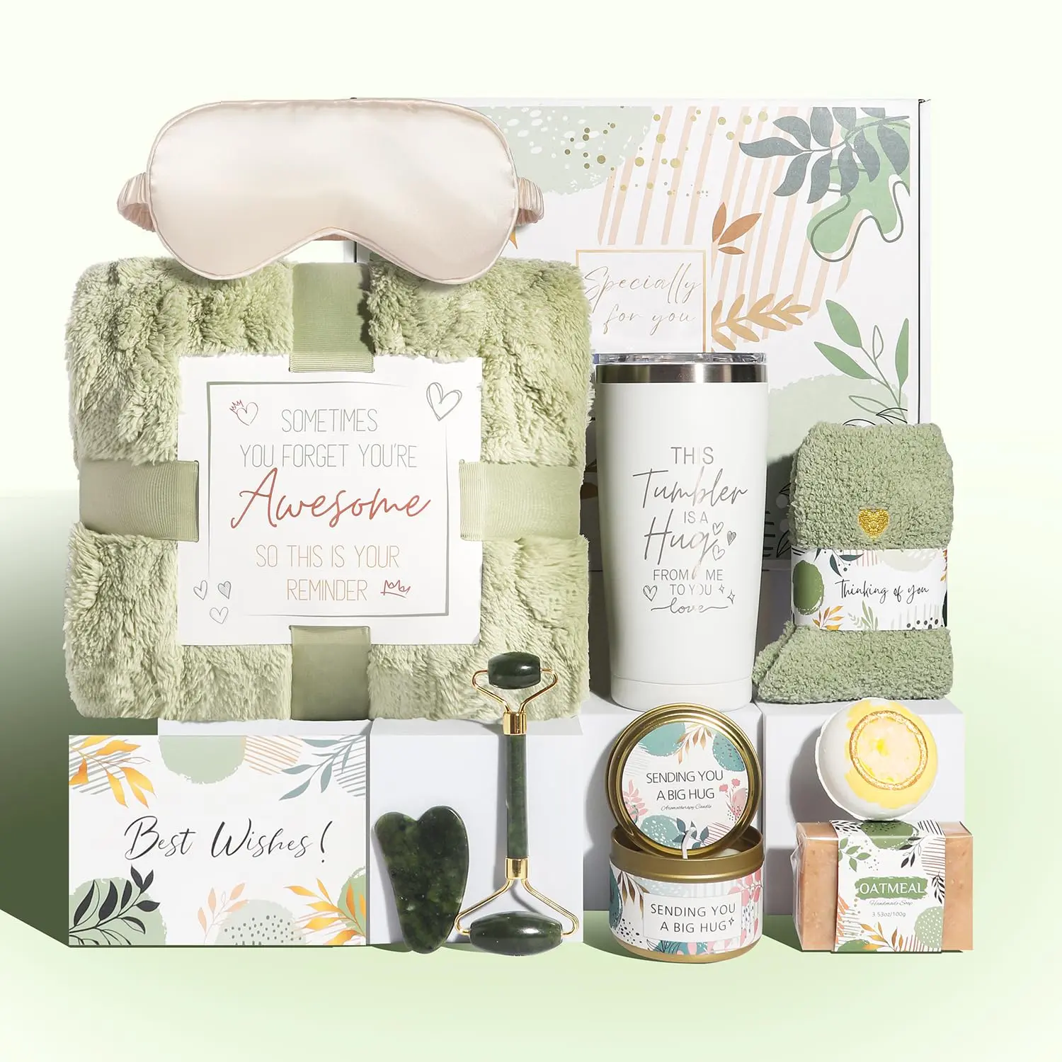 This self care gift basket for women includes a blanket, tumbler, candle, soap, bath bomb, jade roller set, eye mask, and socks.