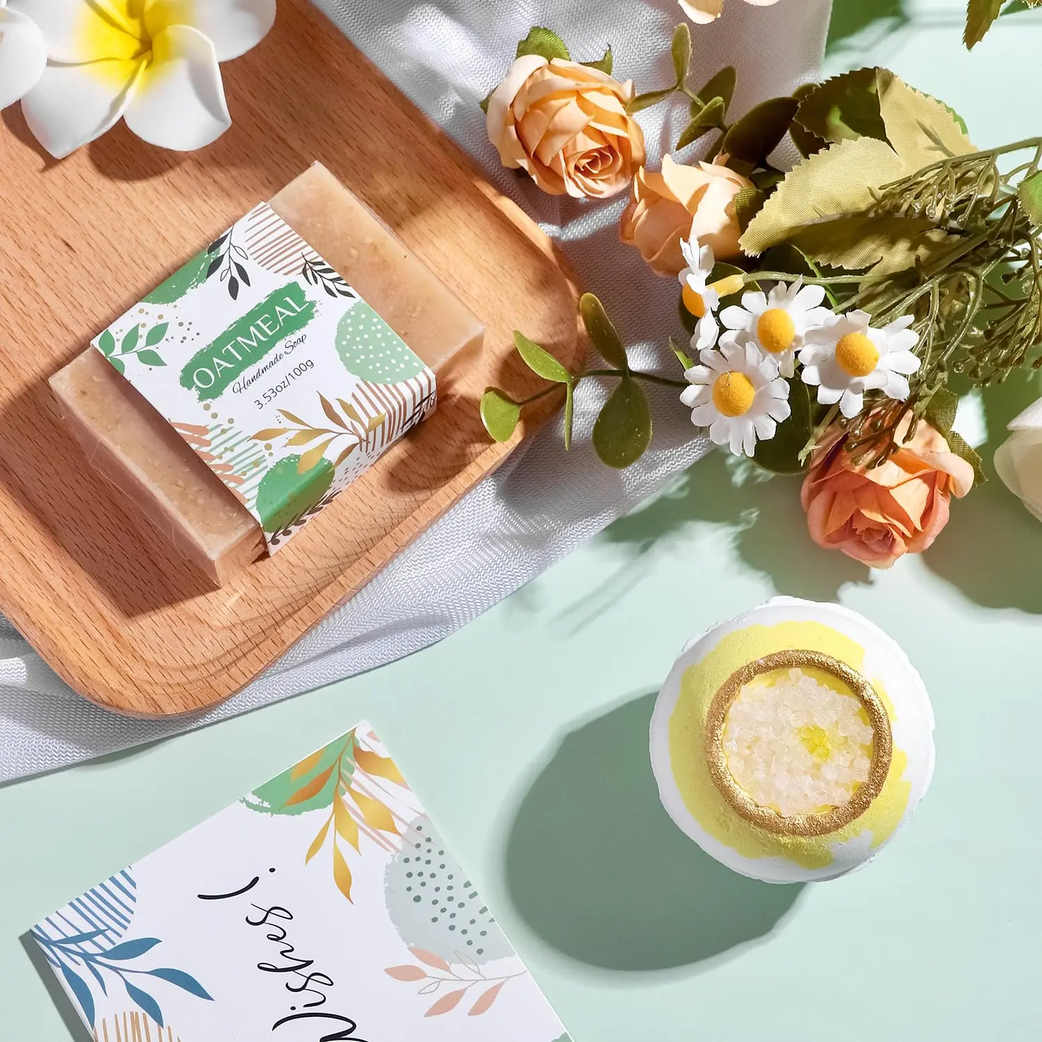 This self care gift basket for women includes a blanket, tumbler, candle, soap, bath bomb, jade roller set, eye mask, and socks.