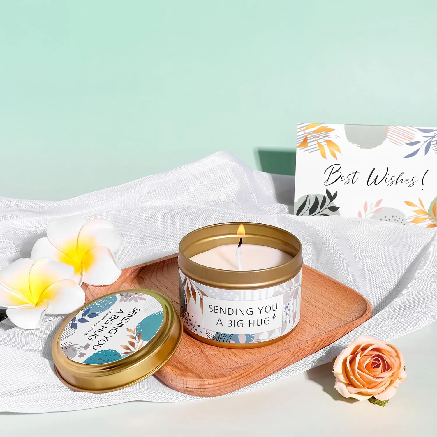 This self care gift basket for women includes a blanket, tumbler, candle, soap, bath bomb, jade roller set, eye mask, and socks.