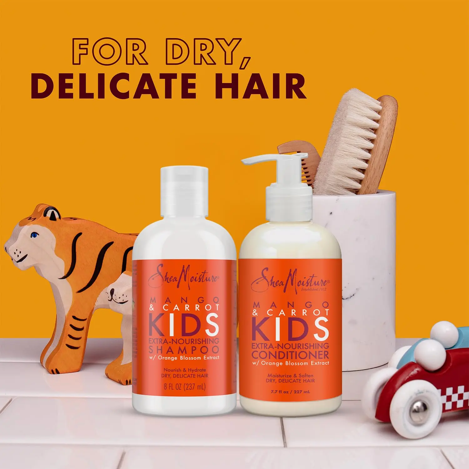 Shea Moisture kids hair care combination pack includes extra-nourishing mango and carrot shampoo, extra-nourishing mango and carrot conditioner, and coconut and hibiscus detangler for soft, smooth, healthy hair.
