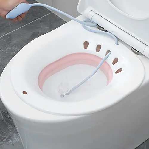 Grey foldable sitz bath basin designed to fit over most standard toilets, providing comfortable perineal soaking for hemorrhoid relief, postpartum recovery, pregnant women, and the elderly, preventing bending and offering a gentle water massage.
