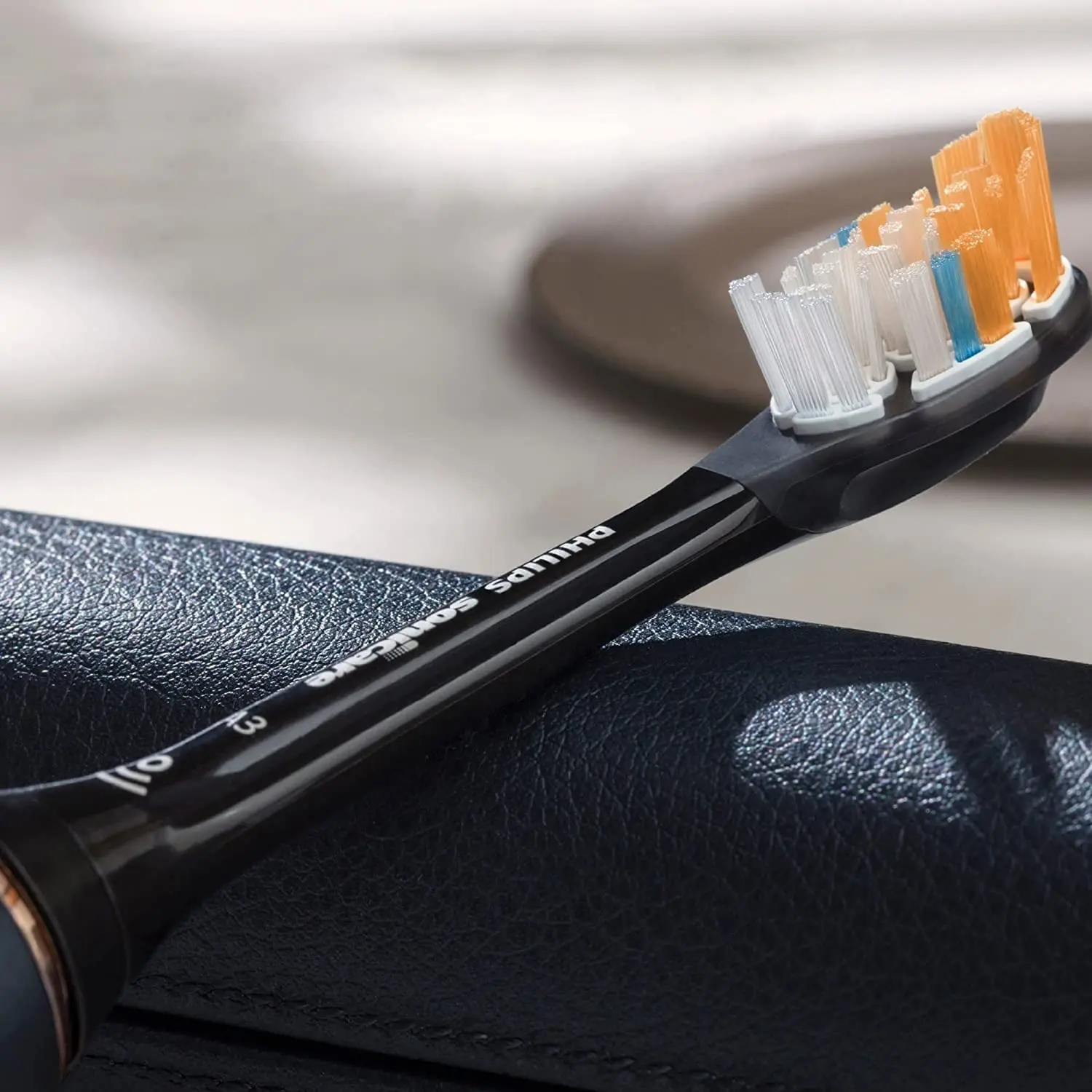 Two black Philips Sonicare HX9092/96 All-In-One brush heads designed for superior plaque removal, stain removal, and gum health, featuring angled bristles, triangular tips and extra-reach side bristles.