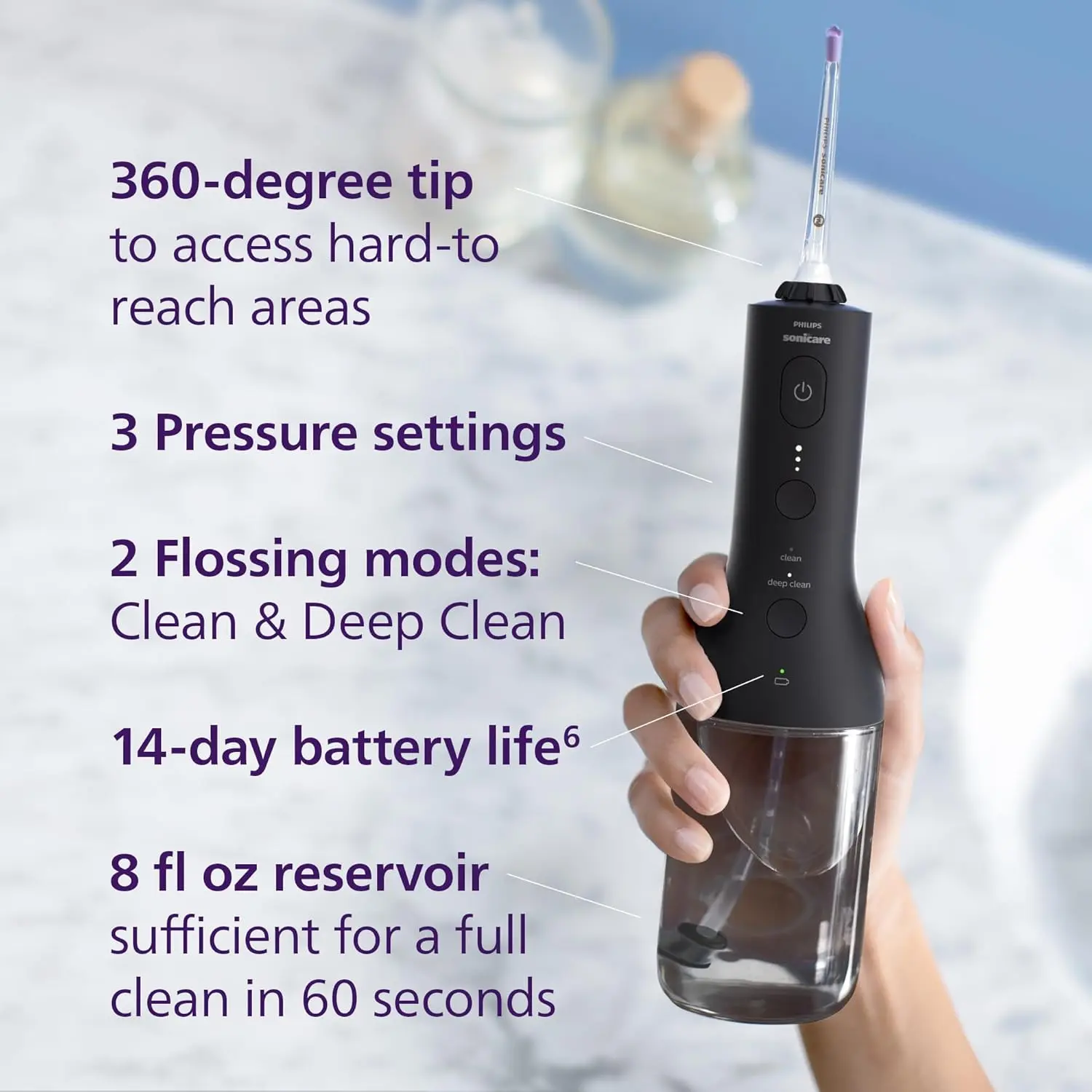 Black SONICARE cordless power flosser featuring quad stream technology for effective cleaning between teeth and along the gumline, complete with charging cable and nozzle attachments.