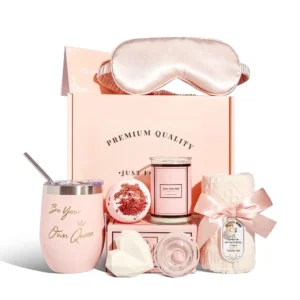 This relaxing spa gift set includes bath bombs, a scented candle, bath soap and towel, blindfold and cup to create the perfect home spa experience for women.