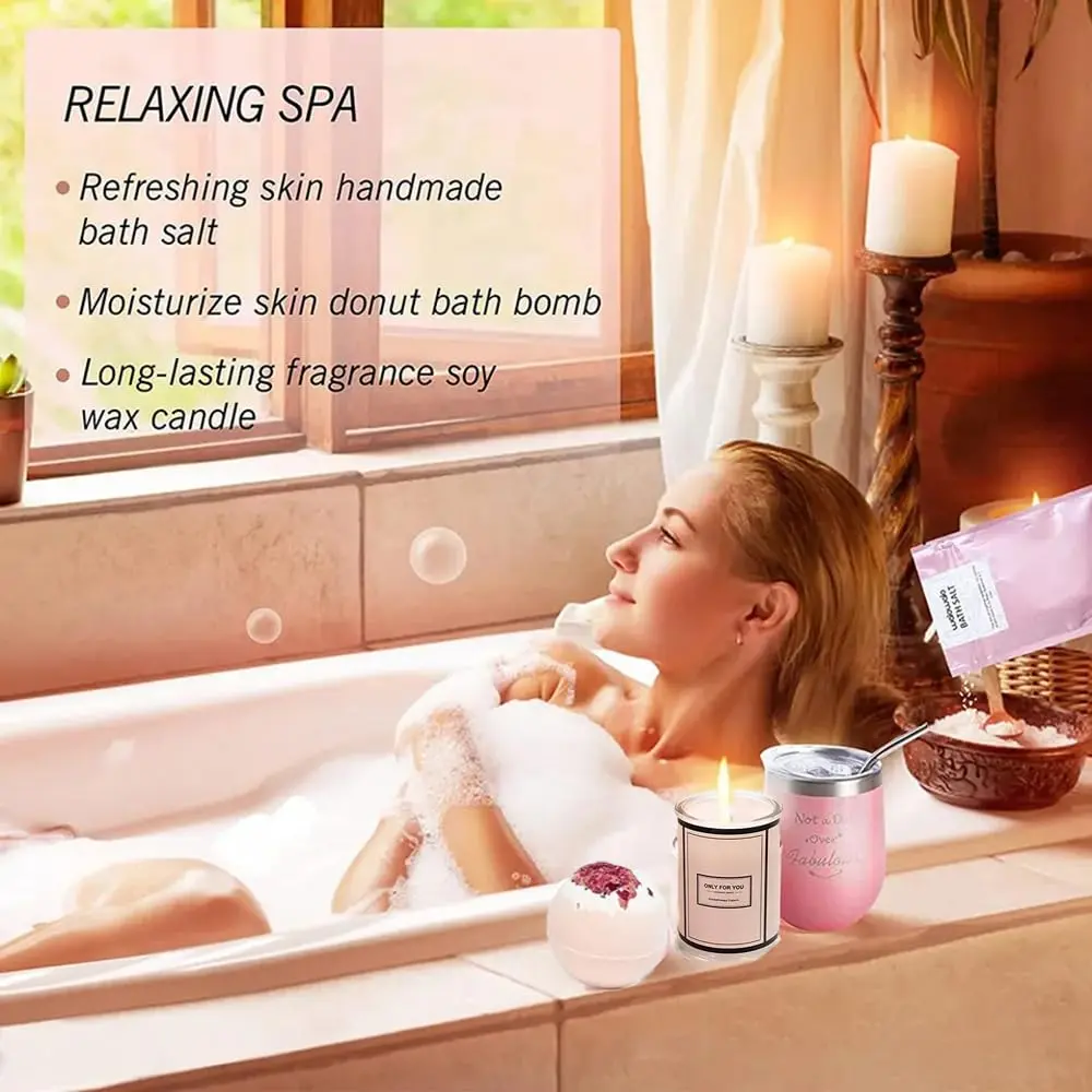 This relaxing spa gift set includes bath bombs, a scented candle, bath soap and towel, blindfold and cup to create the perfect home spa experience for women.