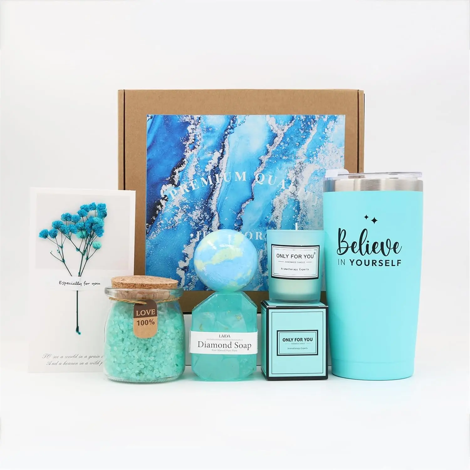 This luxury spa gift set for women includes a lavender bath bomb, handmade soap, bath salts, scented candle, eye mask, headband and greeting card, all arranged in a beautiful gift box.