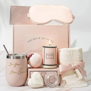 This spa gift set for women includes a tumbler, bath bomb, handmade soap, scented candle, towel, eye mask and gift card perfect for birthday gifts for mom, wife, sister, and best friend.