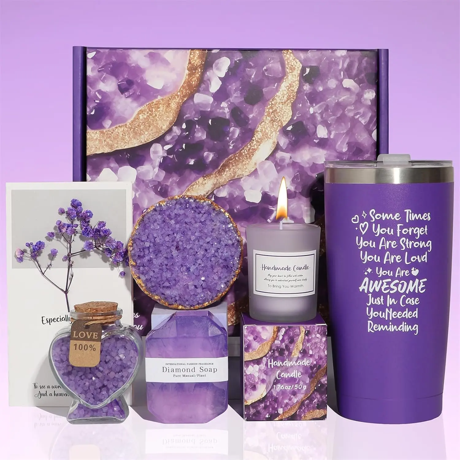 This relaxing lavender spa gift set for women includes a scented candle, bath ball, handmade soap, bath salt, and a car cup, all beautifully packaged in a purple gift box.