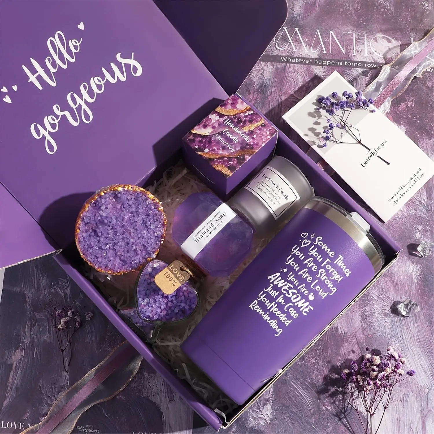 This spa gift set for women includes a lavender candle, bath bomb, handmade soap, bath salts, and a 20oz car cup, all beautifully arranged in a purple gift box.