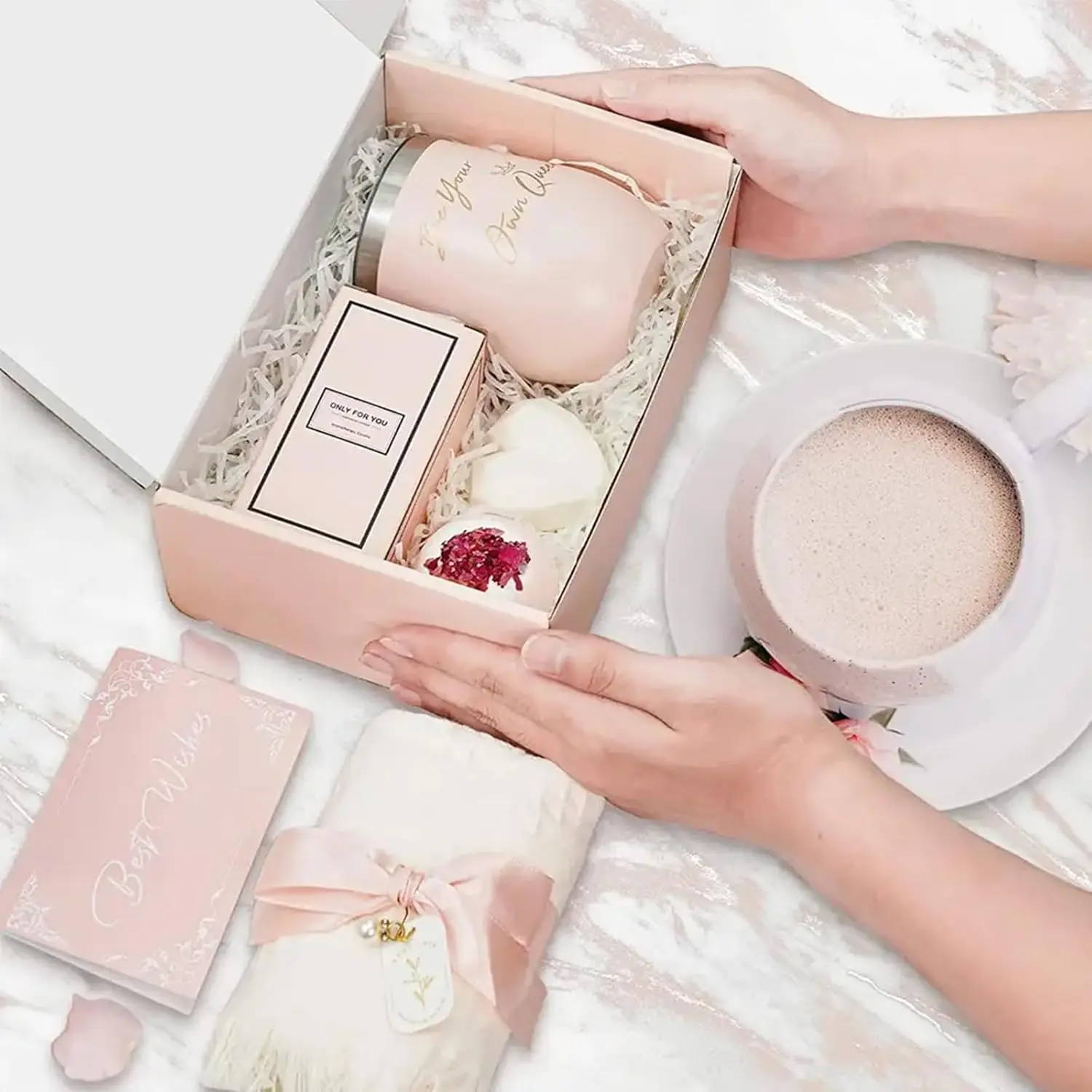 This spa gift set for women includes a tumbler, bath bomb, handmade soap, scented candle, towel, eye mask and gift card perfect for birthday gifts for mom, wife, sister, and best friend.