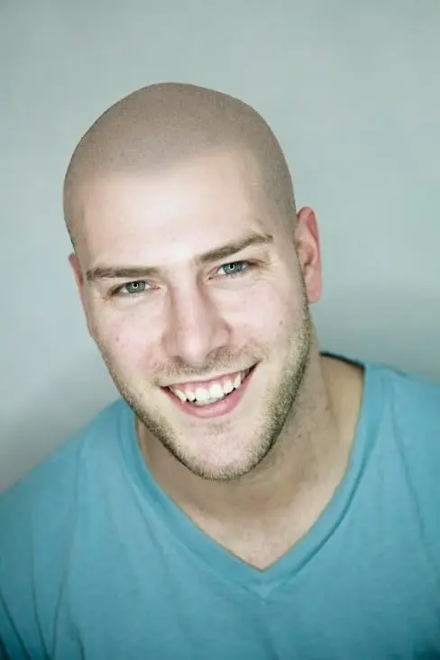 Small jar of SPF for scalp micropigmentation, designed to mattify and moisturize, with instructions to apply lotion first if the scalp is dry.