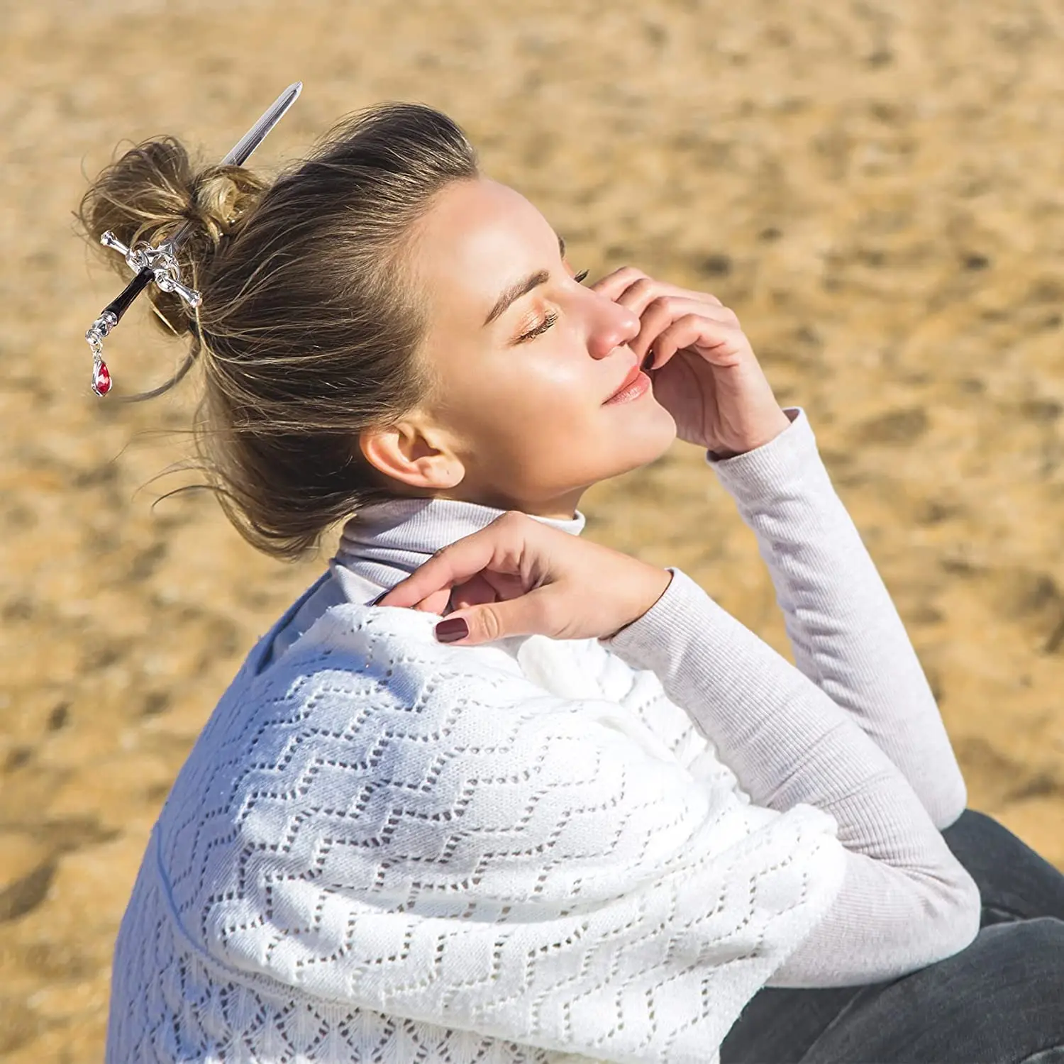 These sword hair pins feature an ancient Chinese style with delicate tassels and gem accents, perfect for styling women's buns in a gold and silver color.