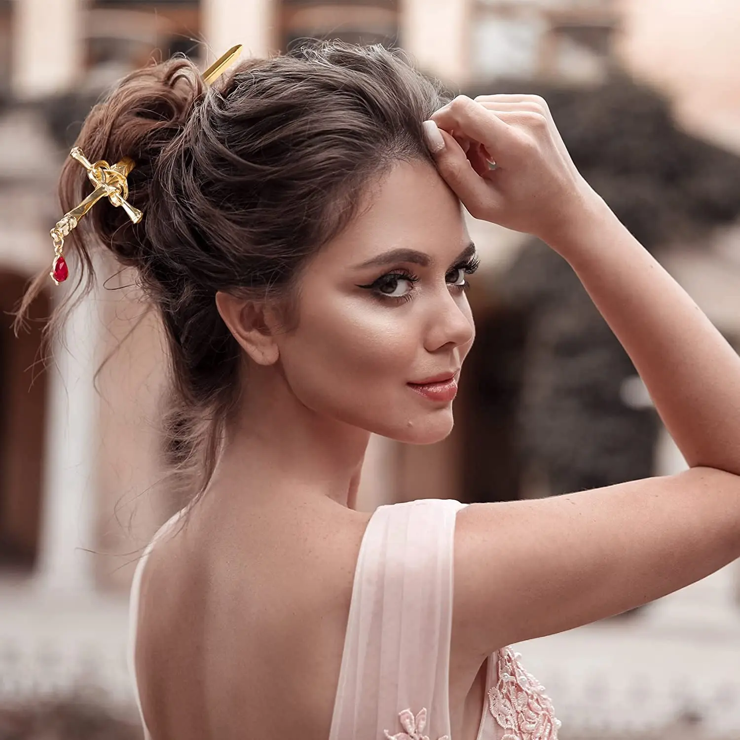 These sword hair pins feature an ancient Chinese style with delicate tassels and gem accents, perfect for styling women's buns in a gold and silver color.