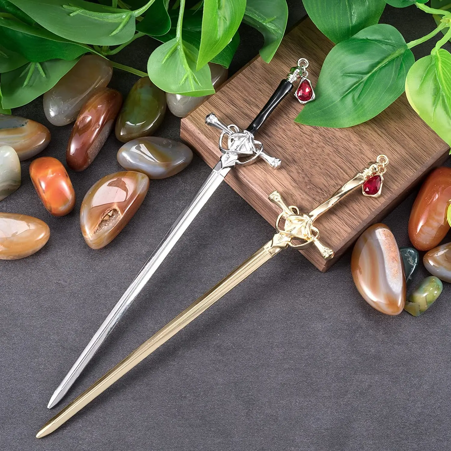 These sword hair pins feature an ancient Chinese style with delicate tassels and gem accents, perfect for styling women's buns in a gold and silver color.