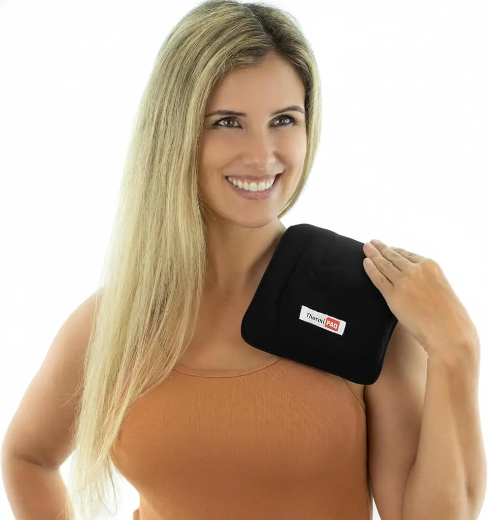 Medium ThermiPaq hot and cold pack with a soft fleece cover and adjustable velcro strap for targeted pain relief on the knee, back, or shoulder.