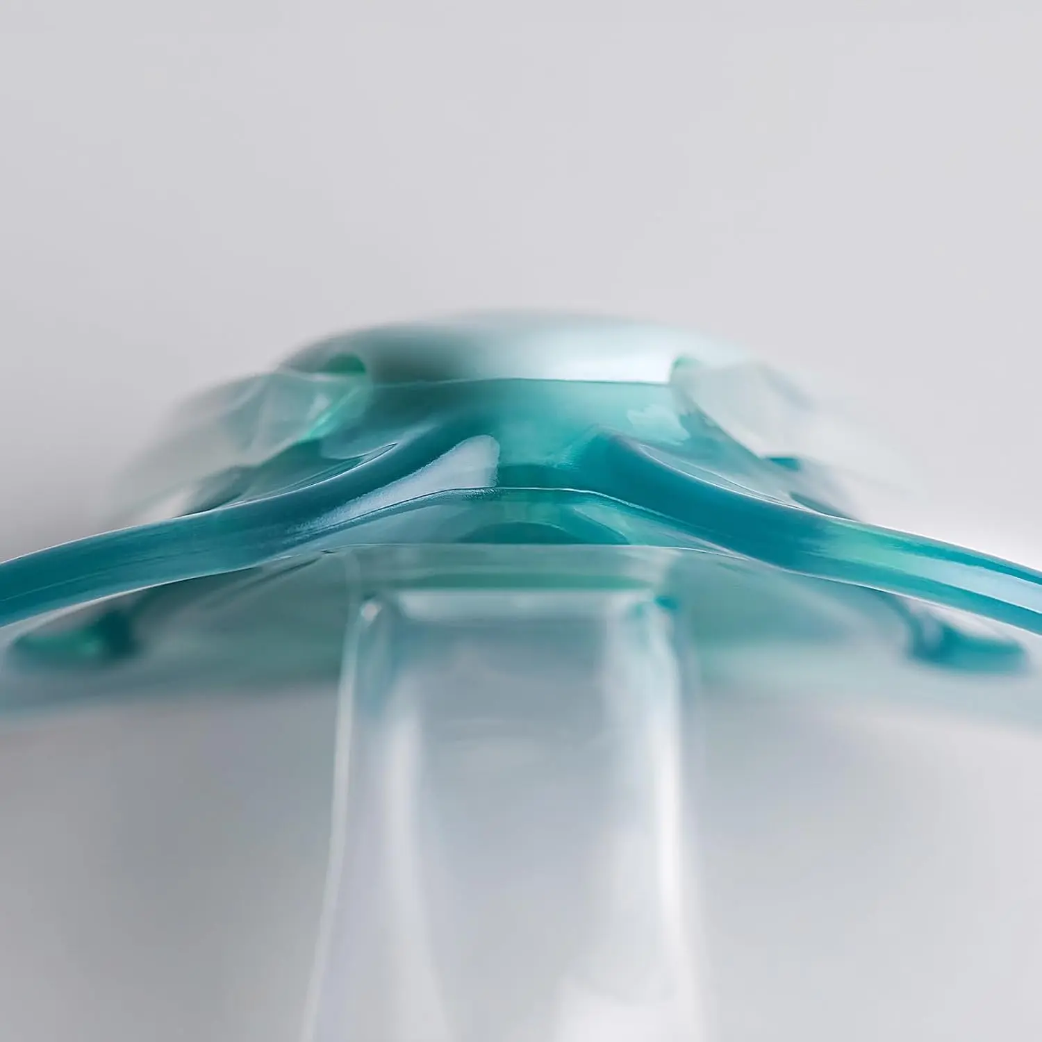 This image shows a 2-pack of Tommee Tippee nighttime pacifiers designed for babies 0-6 months, featuring a glow-in-the-dark design, symmetrical nipple, and a curved shield for comfort and skin protection.