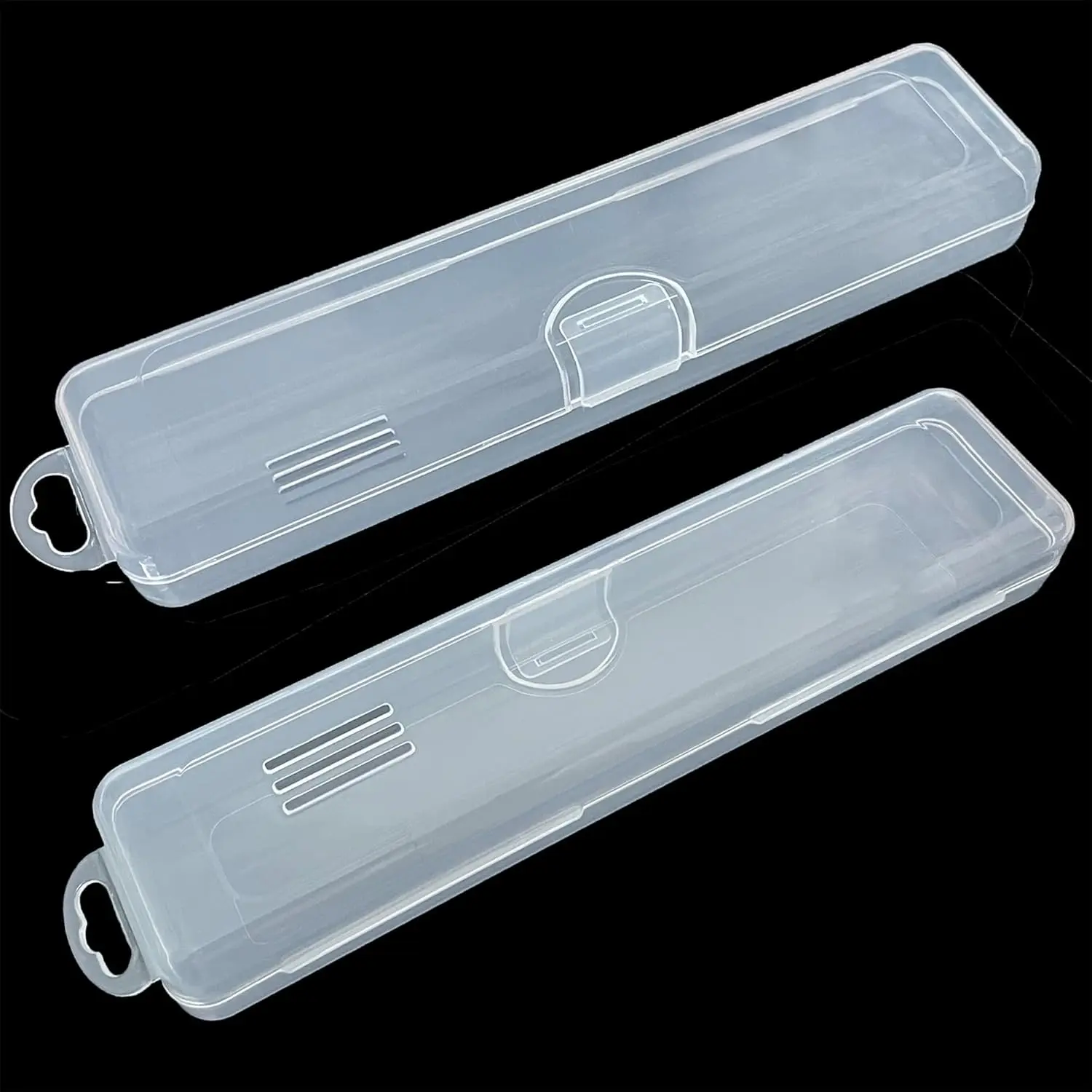This image shows two clear plastic tongue scraper cases, perfect for travel and storage of tongue scrapers and other small items.