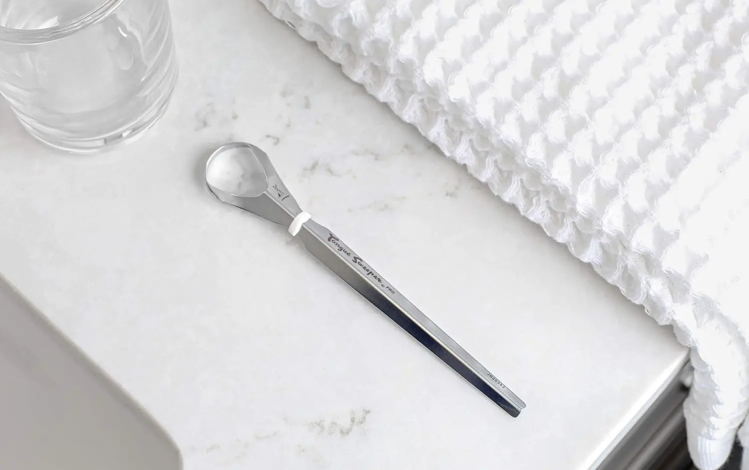 This stainless steel Tongue Sweeper Pro is a durable and hygienic tongue cleaner for effective oral hygiene and fresh breath.