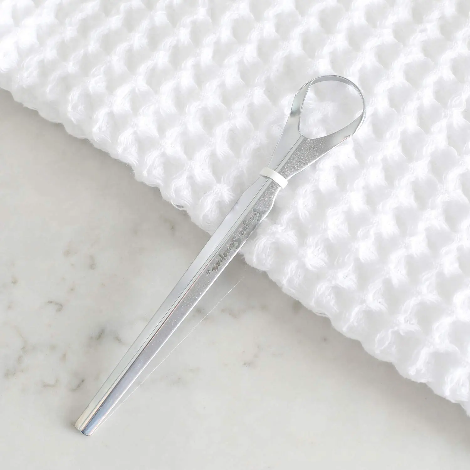 This stainless steel Tongue Sweeper Pro is a durable and hygienic tongue cleaner for effective oral hygiene and fresh breath.