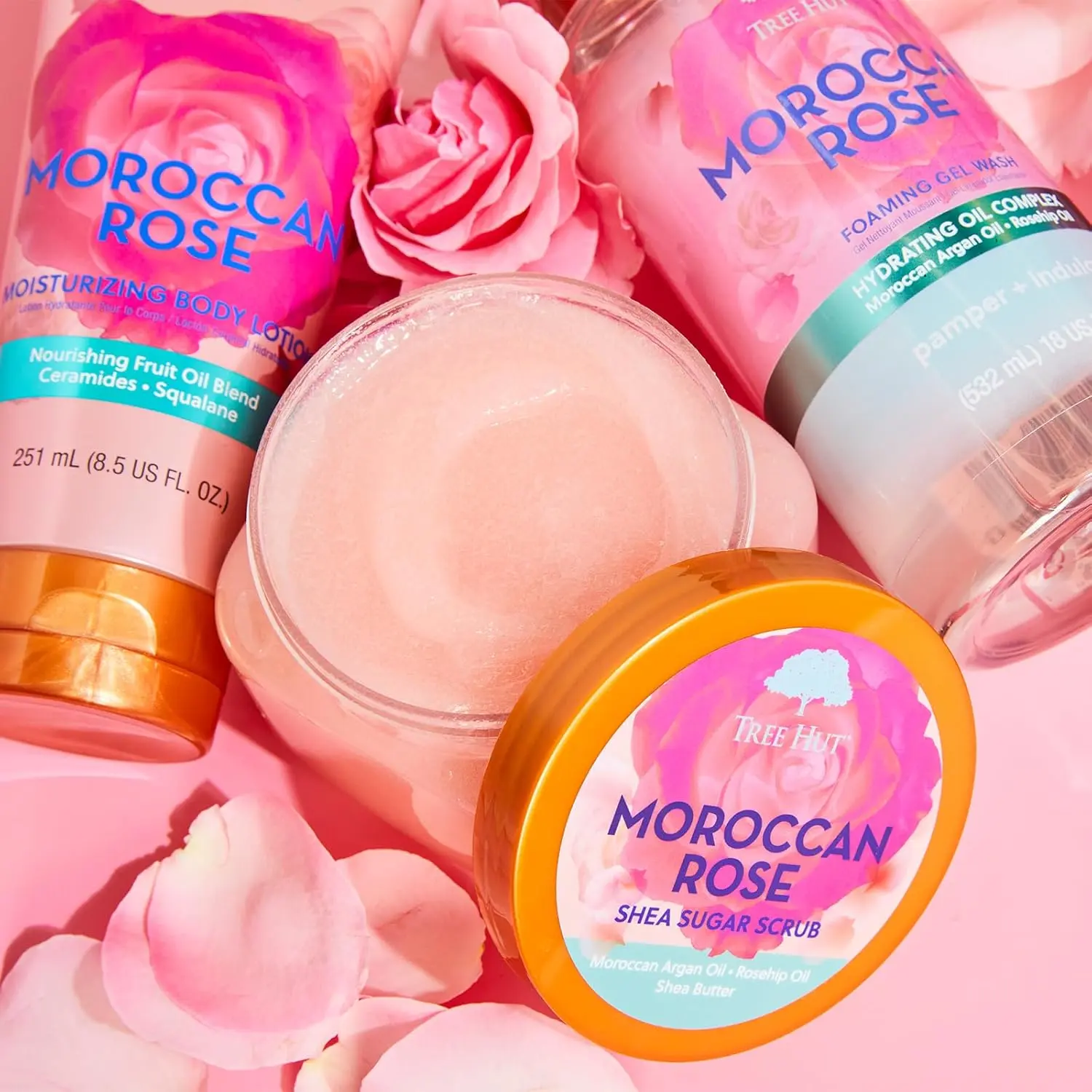 A jar of Tree Hut Moroccan Rose Shea Sugar Scrub provides gentle exfoliation and intense moisturization, leaving skin soft, smooth, and hydrated.