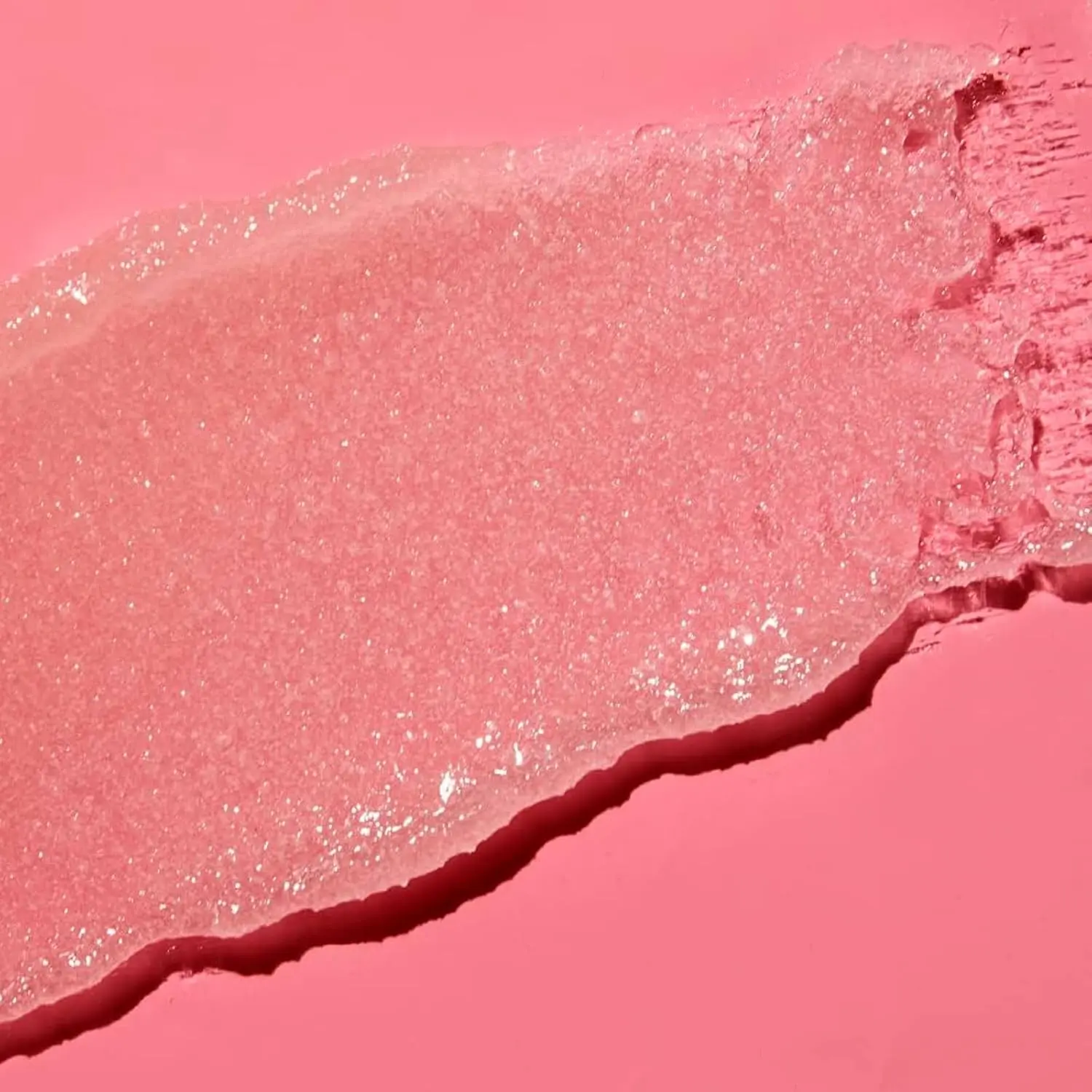 A jar of Tree Hut Moroccan Rose Shea Sugar Scrub provides gentle exfoliation and intense moisturization, leaving skin soft, smooth, and hydrated.