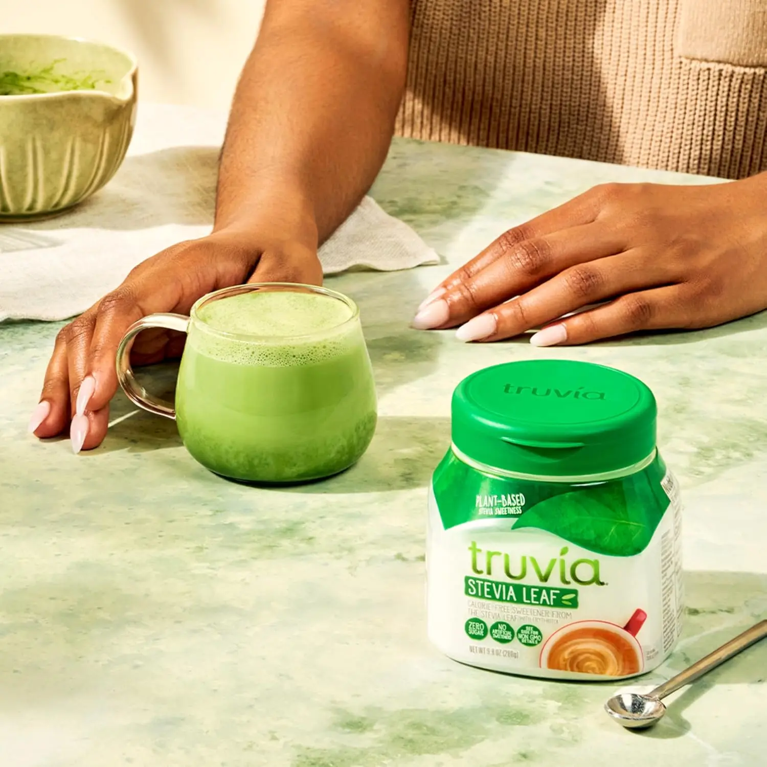 A 9.8 ounce container of Truvia natural sweetener, made from the stevia leaf, offering a zero-calorie alternative to sugar for sweetening food and drinks.