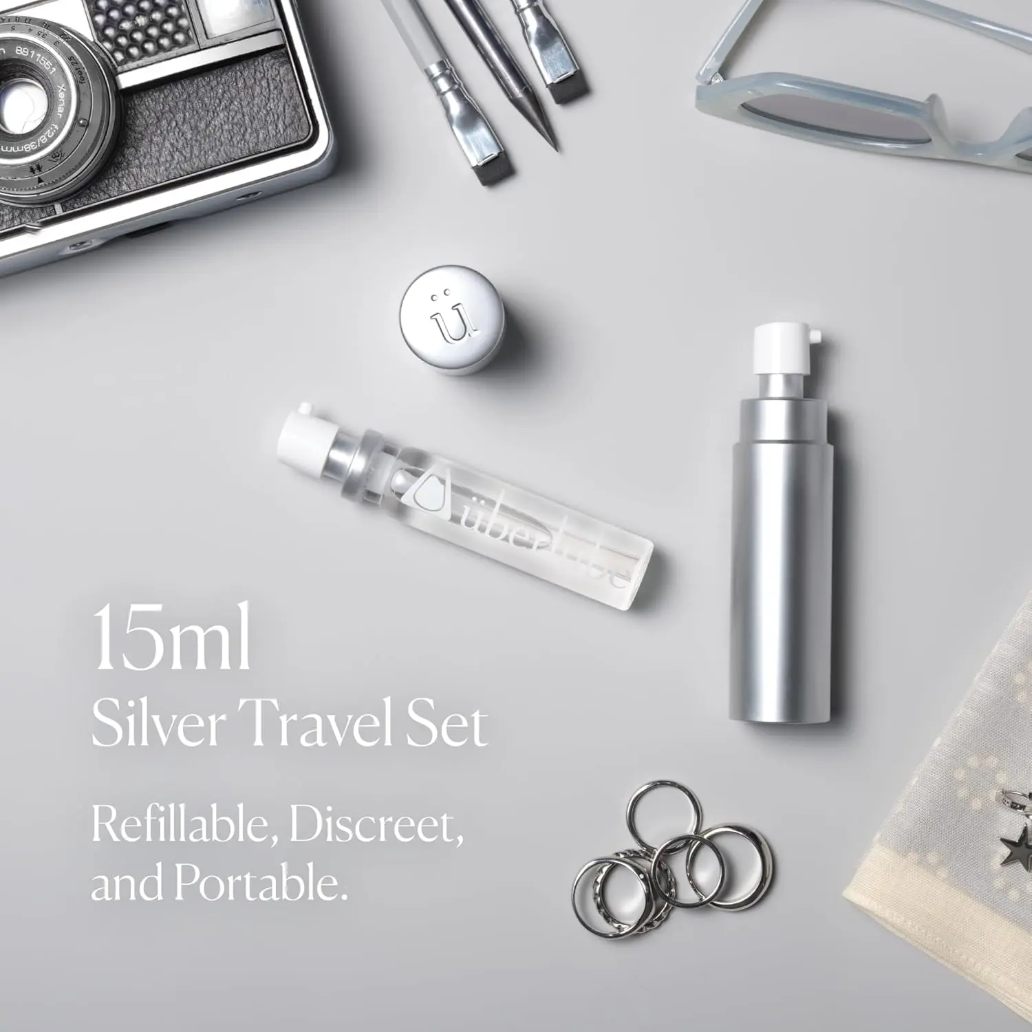 Silver Überlube Good-to-Go travel case with a 15ml refill, providing a convenient and discreet way to carry your favorite lubricant.