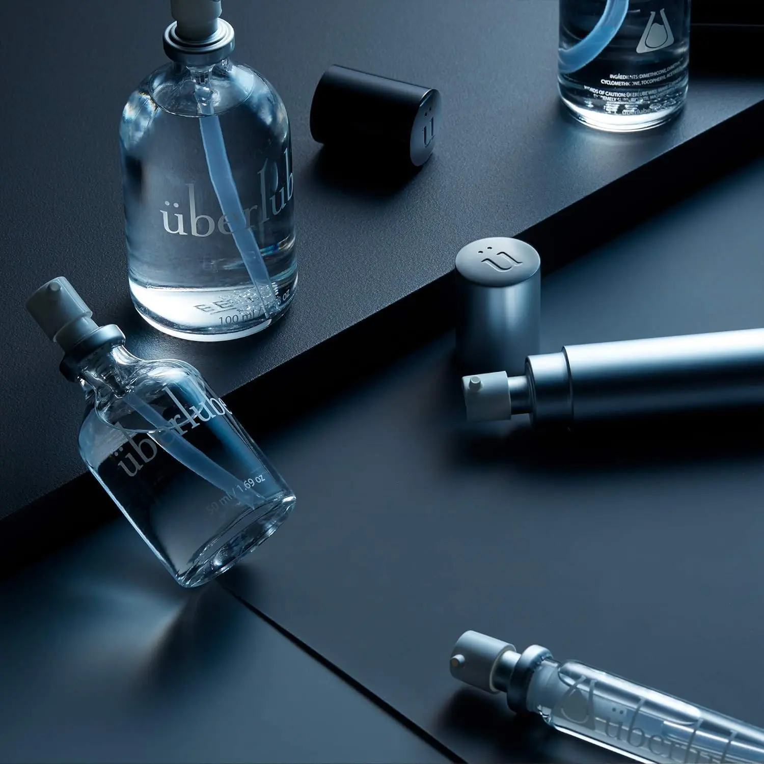 Silver Überlube Good-to-Go travel case with a 15ml refill, providing a convenient and discreet way to carry your favorite lubricant.