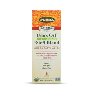 Flora Udo's Choice Omega 369 oil blend in a dark glass bottle, providing essential fatty acids for brain, joint, and heart health with a 2:1 ratio and high lignan content from organic flax, sesame, and sunflower seed oils.
