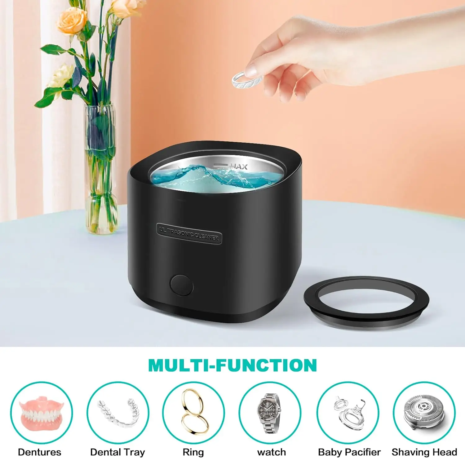 Black portable ultrasonic cleaner effectively removes particulates from dentures, retainers, aligners and mouthguards with 42kHz sound waves.
