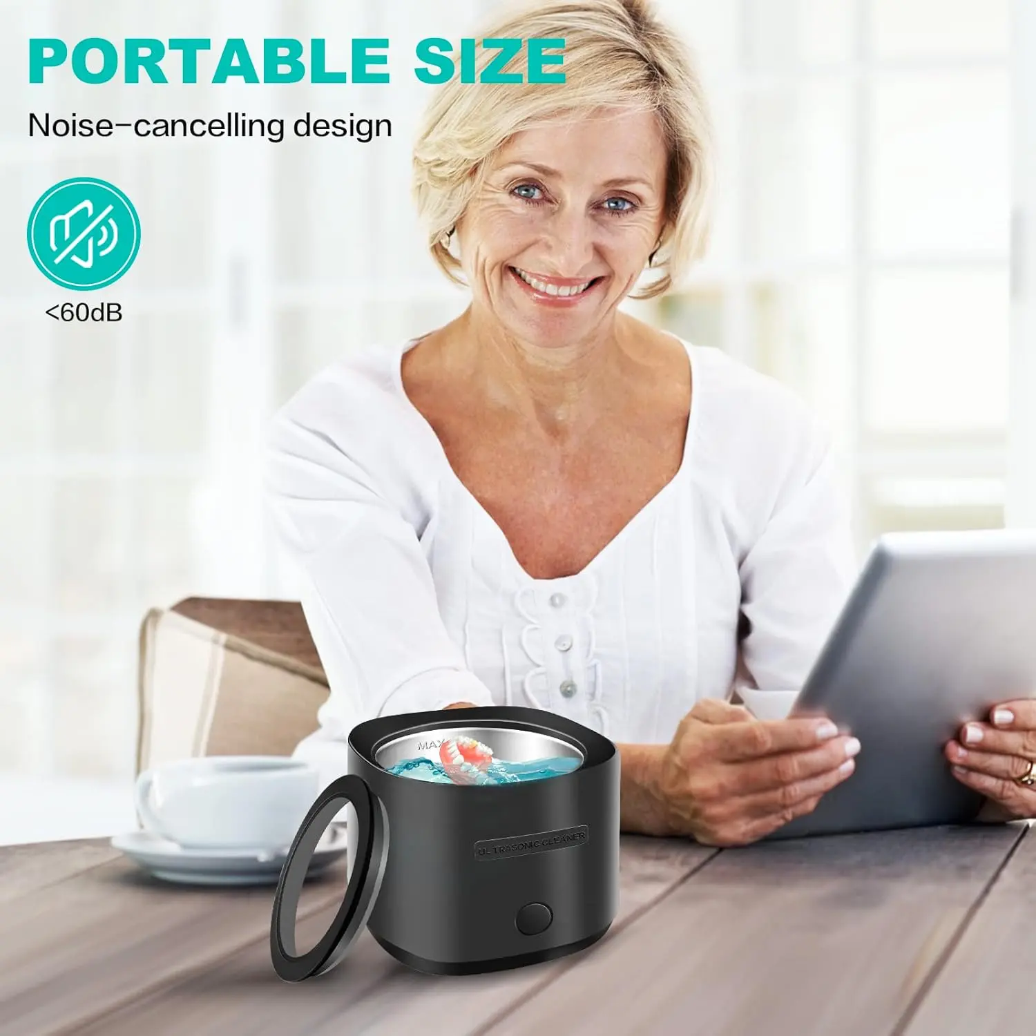 Black portable ultrasonic cleaner effectively removes particulates from dentures, retainers, aligners and mouthguards with 42kHz sound waves.